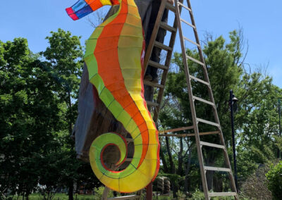 installation of sea horse sculpture in park