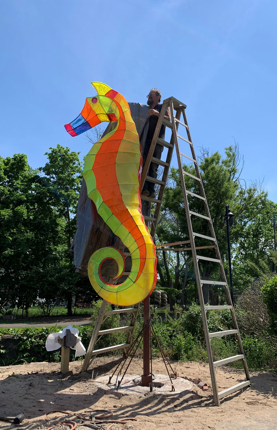 installation of sea horse sculpture in park